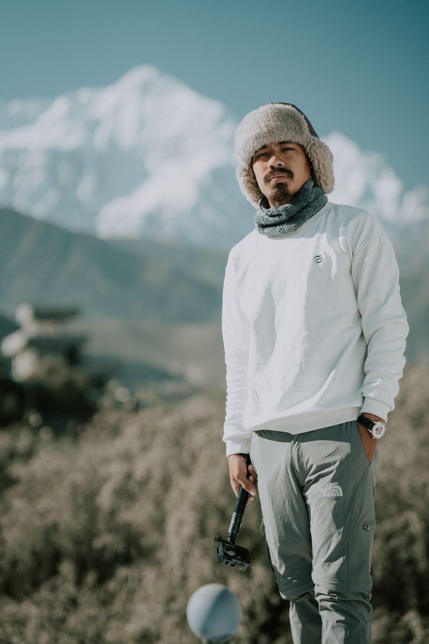 Travel photojournalist in mountains